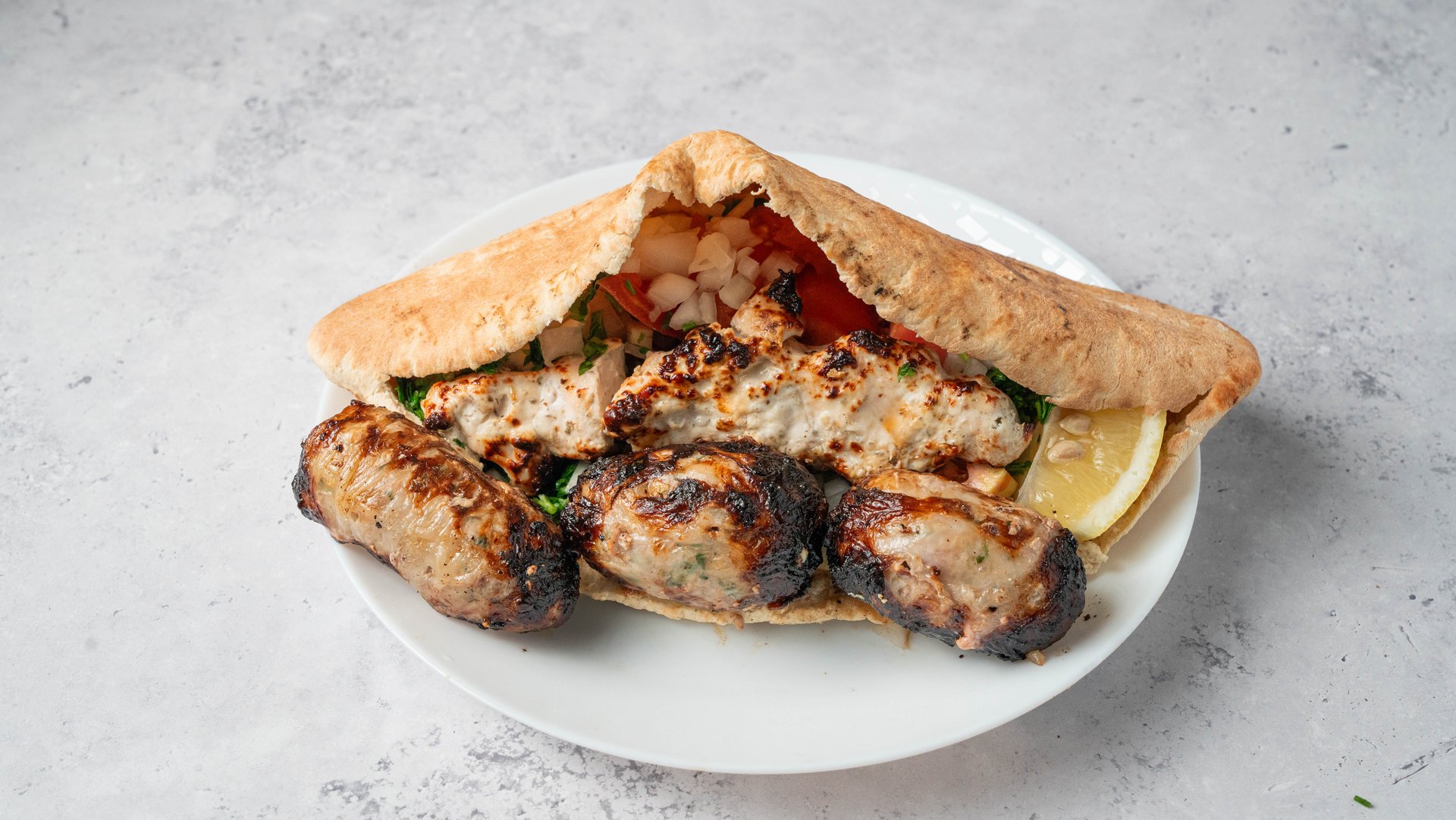 Mixed Chicken and Sheftalia – authentic Cypriot dish at I Xrisi Smila, Larnaca